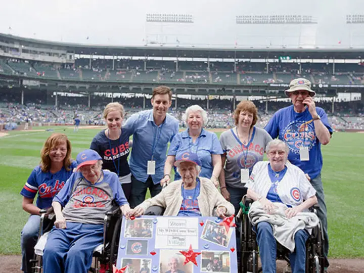 CBV residents joining Louise Sauer at a Cubs game