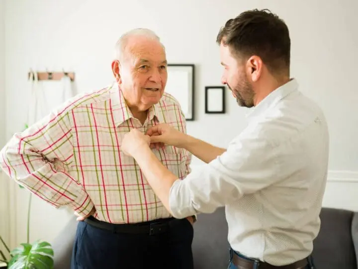 grandson tying grandfathers tie