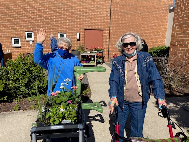 Barb and Joan gardening at CBV 65+ community