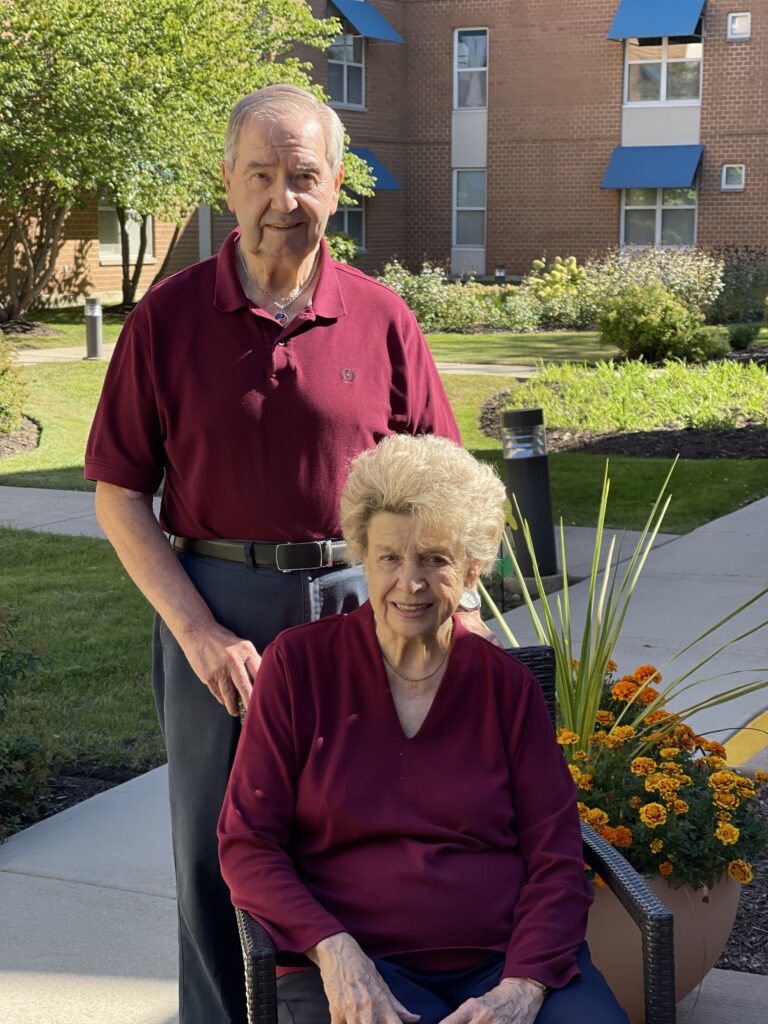 older couple outside at retirement village