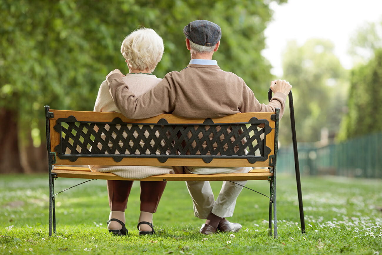couple sitting together outside with Ambiguous Loss from Dementia