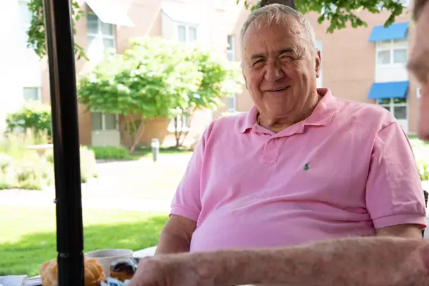 senior man sitting outside at Central Baptist Village