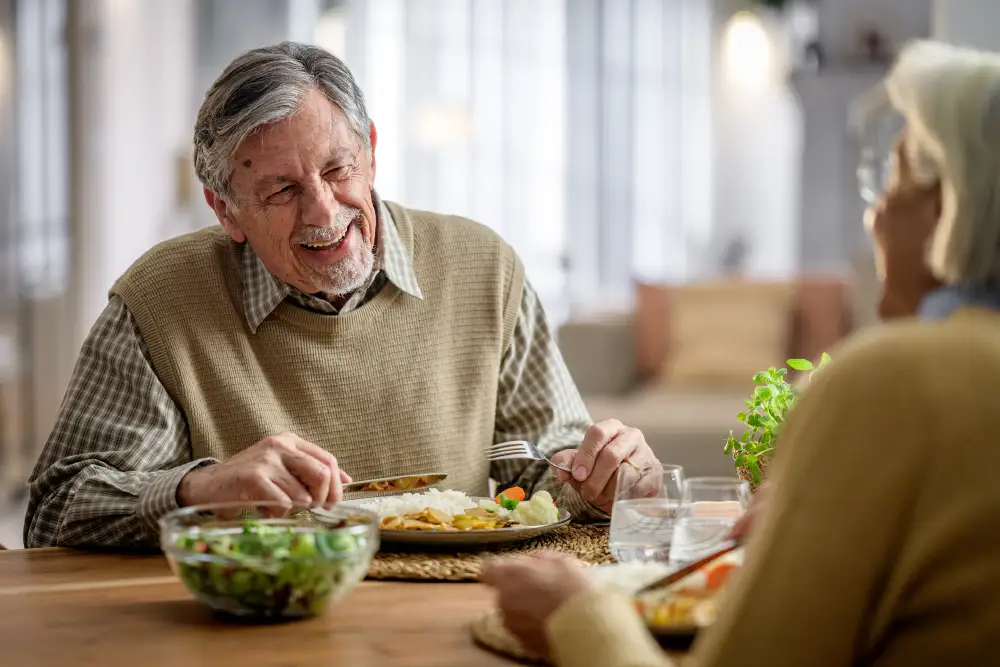 a senior couple eating a healthy meal at home
