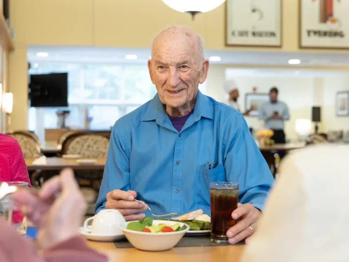 Resident enjoying his lunch in the dining room