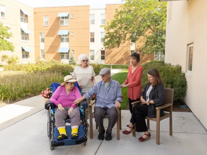 Seniors sitting outside of Central Baptist Village a Skilled Nursing Home in Illinois.