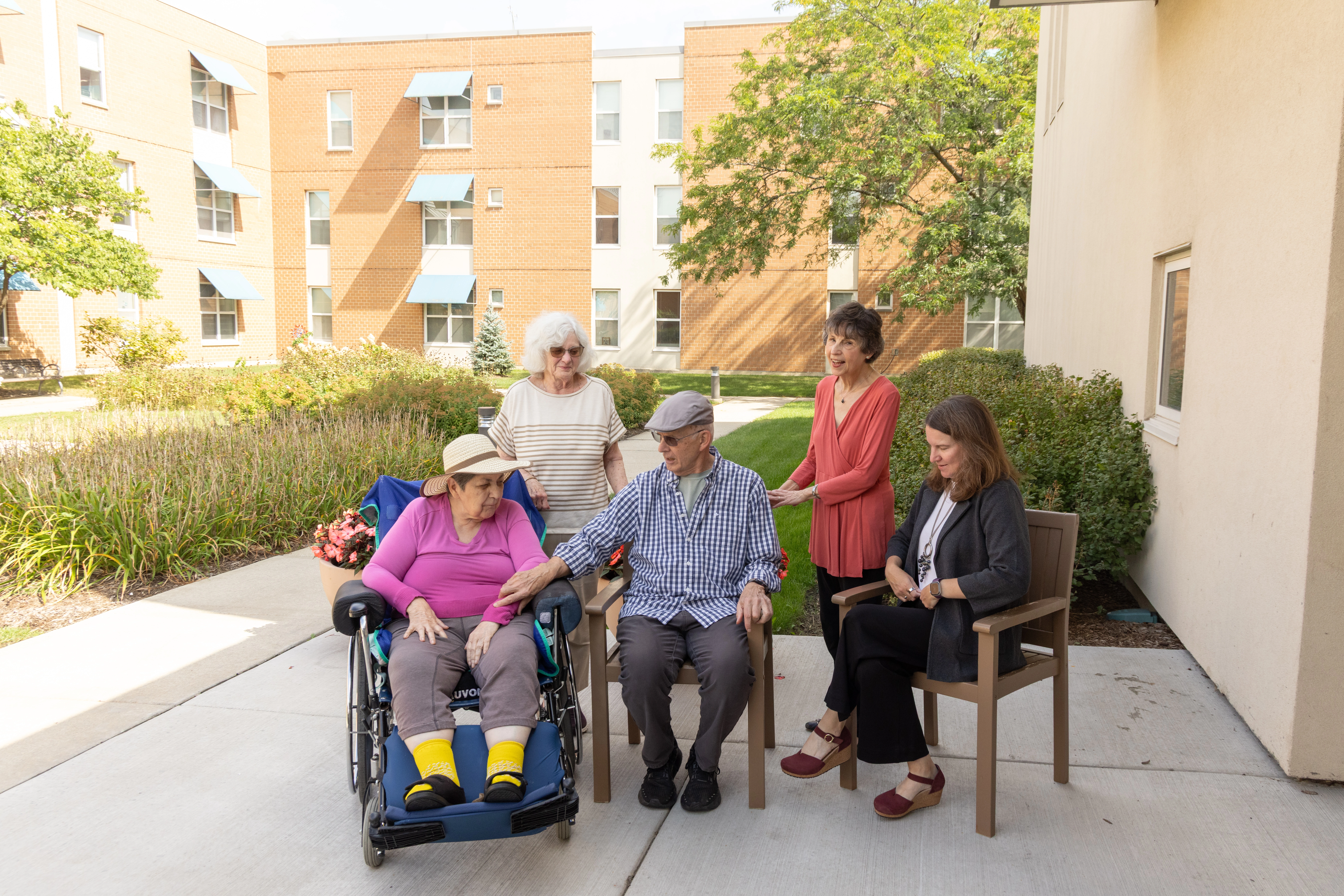 Seniors sitting outside of Central Baptist Village a Skilled Nursing Home in Illinois.