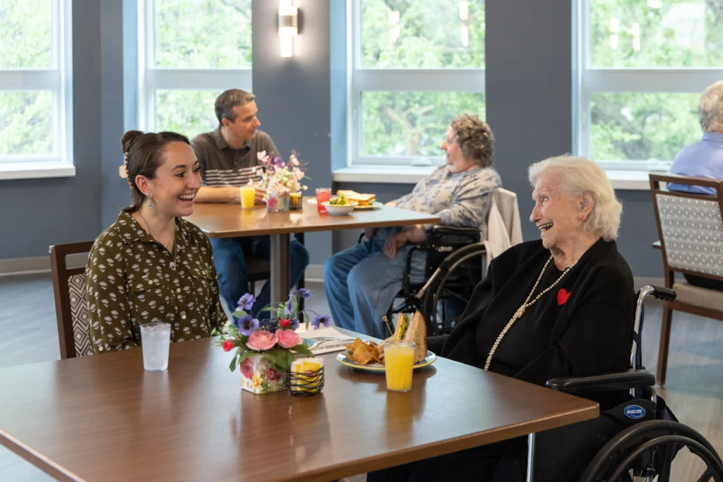 Adult children visiting their elderly parents in skilled nursing care at Central Baptist Village in Illinois.