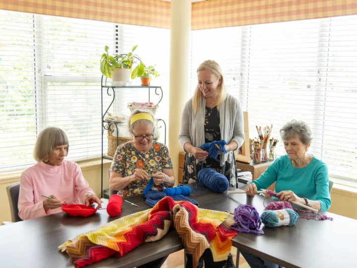 Ladies find life enrichment in knitting at Central Baptist Village.