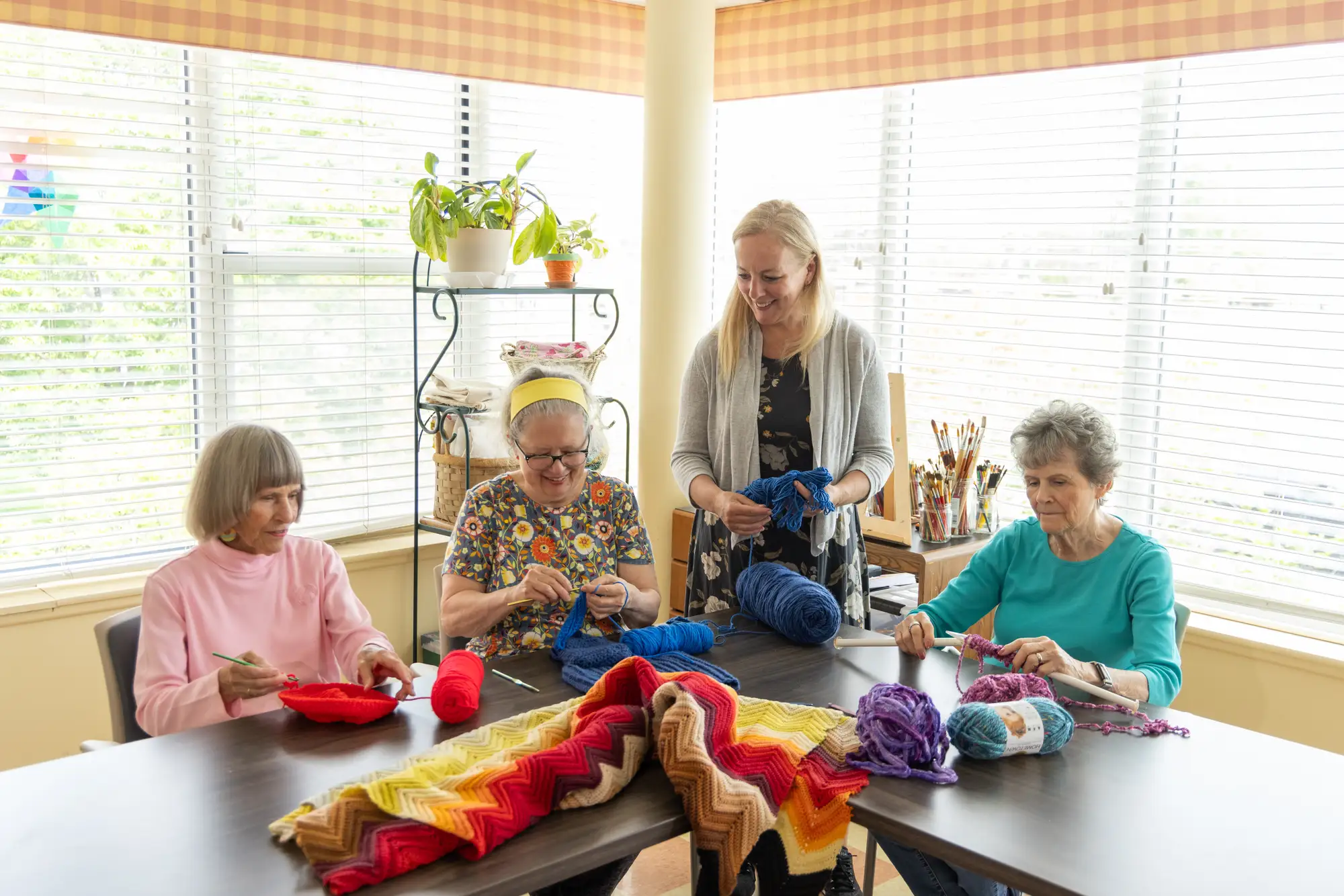 Ladies find life enrichment in knitting at Central Baptist Village.