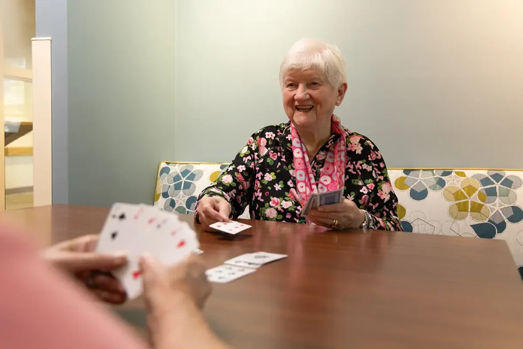 Senior in assisted living in Norridge, Illinois enjoying engaging activity 